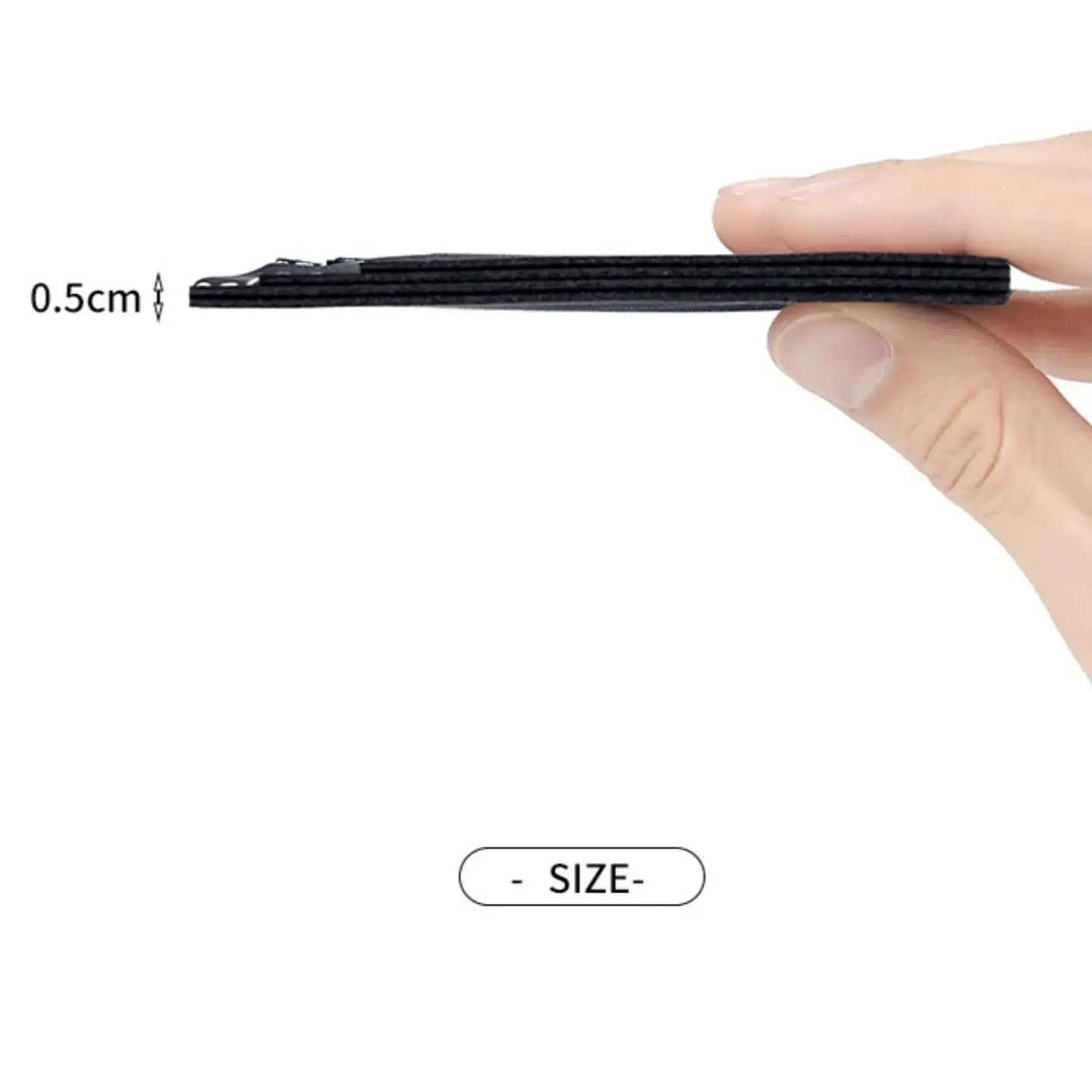 Side view held between fingers showing the 0.5 cm profile