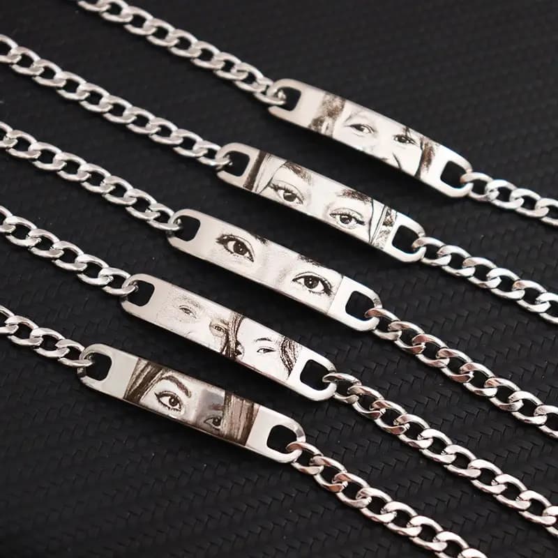 Five silver engraved eye bracelets, angled view